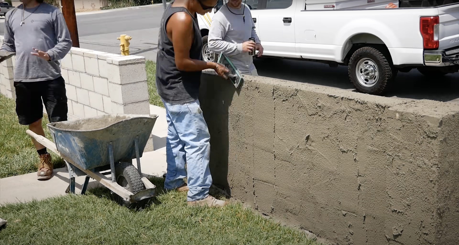 Professional concrete contractors at work in Dover, NH Concrete construction team working on residential driveway project