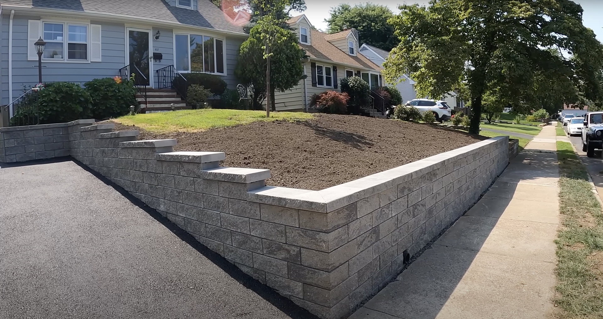 Concrete retaining wall construction in Dover, NH Residential concrete retaining wall construction with professional block installation