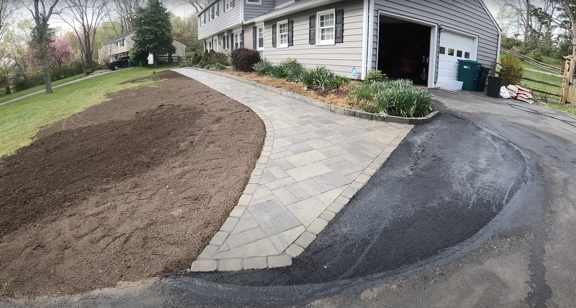 Decorative concrete driveway and walkway project Curved stamped concrete driveway and walkway showing professional design and installation