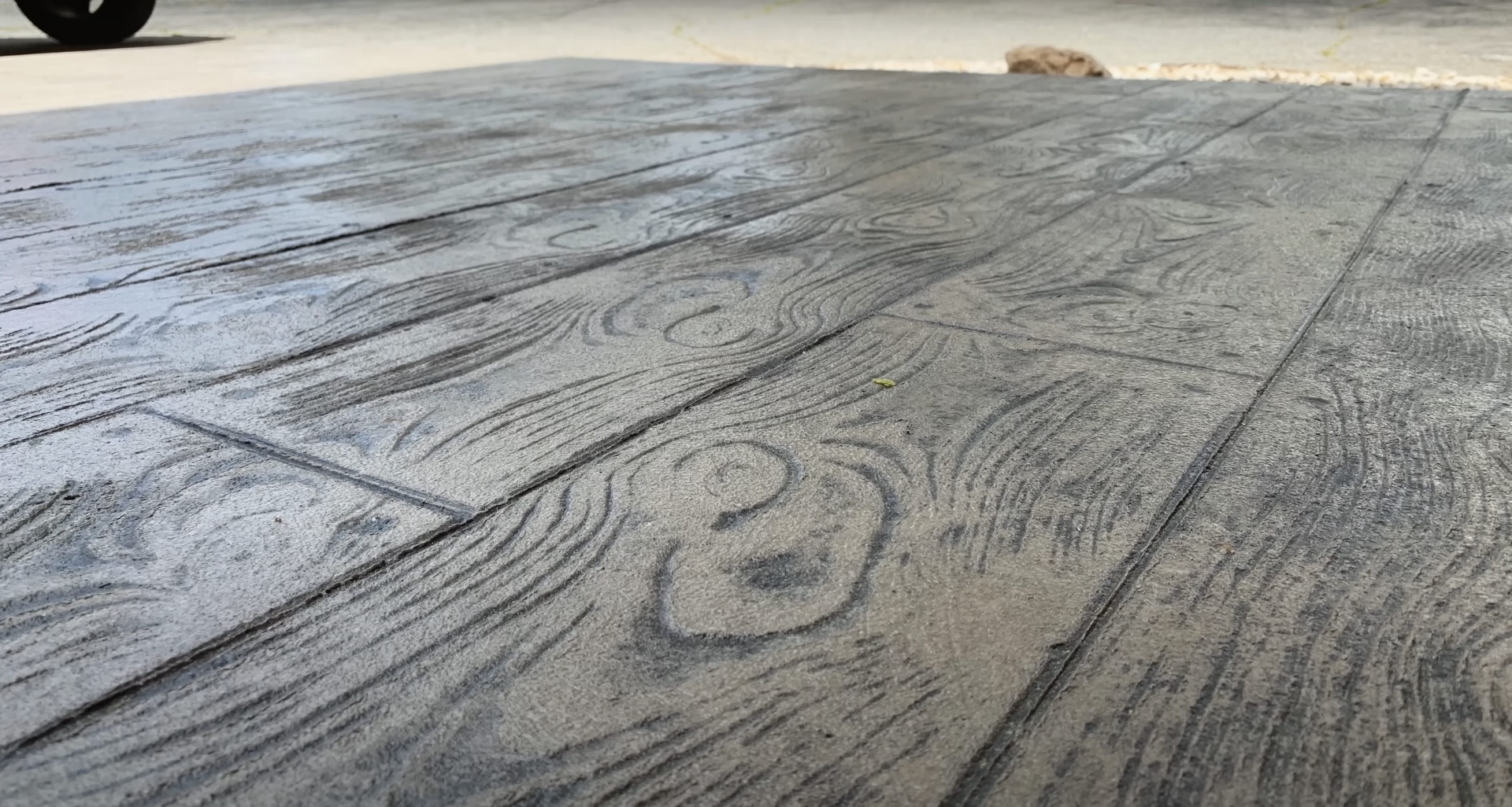 Wood grain stamped concrete surface by Dover Concrete Construction Stamped concrete surface with realistic wood grain pattern and texture